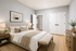 Elegant bedroom with a cozy bed, soft lighting, and modern decor creating a serene retreat.