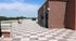 Charming rooftop terrace with elegant tiled flooring and scenic views, perfect for relaxation and entertaining.