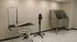 Modern pet grooming station featuring a sleek adjustable table, professional dryer, and convenient stainless steel wash area.