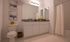 Elegant bathroom featuring sleek granite countertops, stylish decor, and a modern white cabinet with ample storage.