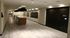 Modern apartment hallway with chic lighting, sleek mailboxes, and a package concierge system.