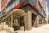 Inviting contemporary apartment exterior adjacent to Broad-Spring Garden metro entrance with nearby shopping options.