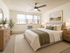 Inviting bedroom with a cozy double bed, elegant furniture, and natural light flooding through large windows.