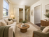 Bright and cozy living room featuring stylish neutral decor, plush seating, and elegant lighting, perfect for relaxation.