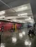 Spacious and modern gym with state-of-the-art exercise equipment and polished floors, perfect for fitness enthusiasts.