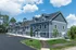 Charming modern apartment building with stylish blue siding and lush green landscaping under a bright sky.