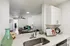 Chic open-plan living area with a modern kitchen, elegant countertops, and welcoming decor, perfect for relaxation and entertaining.