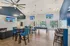 Modern community lounge with vibrant design, chic seating, and inviting decor, perfect for social gatherings and relaxation.