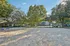 Inviting outdoor sand area surrounded by lush trees, perfect for recreation and leisure activities.
