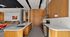 Contemporary kitchen design showcasing sleek wood cabinetry, elegant countertops, and modern appliances in an open, stylish space.