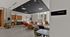 Sleek and contemporary lounge area with stylish seating, open kitchen, and ample natural light.