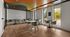 Modern meeting room with sleek design, featuring round tables, stylish chairs, and floor-to-ceiling windows offering natural light and scenic views.