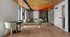 Modern communal dining area with stylish chairs, sleek tables, and vibrant ceiling design.