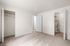 Bright and spacious bedroom with plush carpet, open closet space, and neutral walls for a modern touch.