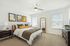 Second bedroom with large windows.