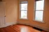 bedroom at 1114 mound st. lots of windows and natural light. includes a closet