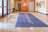 Inviting lobby of Element Apartments featuring elegant lighting, modern decor, and a welcoming floor mat.