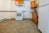 Charming kitchen with spacious countertops, wooden cabinetry, and modern appliances, perfect for culinary adventures.