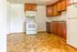 Inviting kitchen with hardwood cabinets, modern appliances, and spacious countertops for an ideal culinary experience.