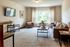 Bright and inviting living room with contemporary furniture, large window view, and elegant decor for a cozy atmosphere.