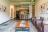 Inviting open-concept apartment with cozy seating area, modern kitchen, and stylish decor, perfect for comfortable living.