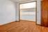 Bright room with elegant wood flooring and spacious built-in closet ready for personalization.