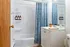 Bright, modern bathroom featuring elegant cabinetry, stylish shower curtain, and decorative accents for a fresh look.