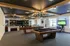 Luxurious entertainment area with a billiards table, cozy seating, and elegant lighting  | Liv+ Union Peak | Phoenix, Arizona