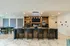 Stylish modern lounge area with sleek bar seating and contemporary artwork Tastefuly decorated lounge with comfortable | Liv+ Union Peak | Phoenix, Arizona