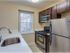 Kitchen with stainless steel appliances at Harvard Village Apartments in Adams Morgan DC