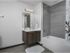 Bathroom featuring quartz countertops.