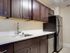 Kitchen with stainless steel appliances at The Argonne Apartments in Columbia Heights