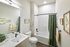 bathroom with tub and vanity