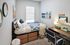 bedroom with bed, dresser and desk