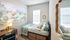 bedroom with bed, dresser and desk