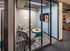 Private room with glass doors off of common area  at The Henry | Apartments in Tampa, FL