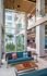 Seating area of common space with large windows  at The Henry | Apartments in Tampa, FL