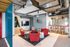 Seating with flat-screen and modern art  at The Henry | Apartments in Tampa, FL