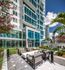 Outside landscaping and seating  at The Henry | Apartments in Tampa, FL