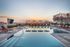Pool with sun deck, poolside cabanas  at The Henry | Apartments in Tampa, FL