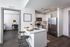 Kitchen featuring breakfast bar and stainless steel appliances  at The Henry | Apartments in Tampa, FL