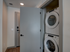 Stacked washer/dryer set in closet at The Henry | Apartments in Tampa, FL.