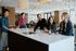 people standing around a table