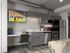 Studio room with kitchen plus built-in desk and mounted TV