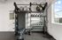 Modern fitness center equipped with kettlebells, exercise balls, resistance bands, and a workout bench, offering a bright and motivating space.