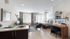 Modern studio apartment with an open layout featuring a cozy living space, elegant bedroom area, and stylish kitchen counter for dining.