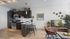 Modern open-plan kitchen and living area with stylish dark cabinetry, a sleek breakfast bar, and cozy seating, highlighted by elegant decor and warm wood flooring.