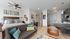 Modern studio apartment showcasing a cozy living area with stylish decor, a comfortable bed, and a sleek kitchen with dining space.