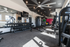 Modern fitness center with state-of-the-art gym equipment, large mirrors, and ample natural light.
