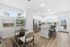Bright and modern kitchen with sleek cabinetry, a central island, and stylish dining nook, perfect for entertaining.
